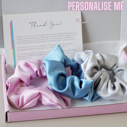 Pink, Blue and Silver satin scrunchies in pink gift box, branded tissue paper and personalised note with neon text.