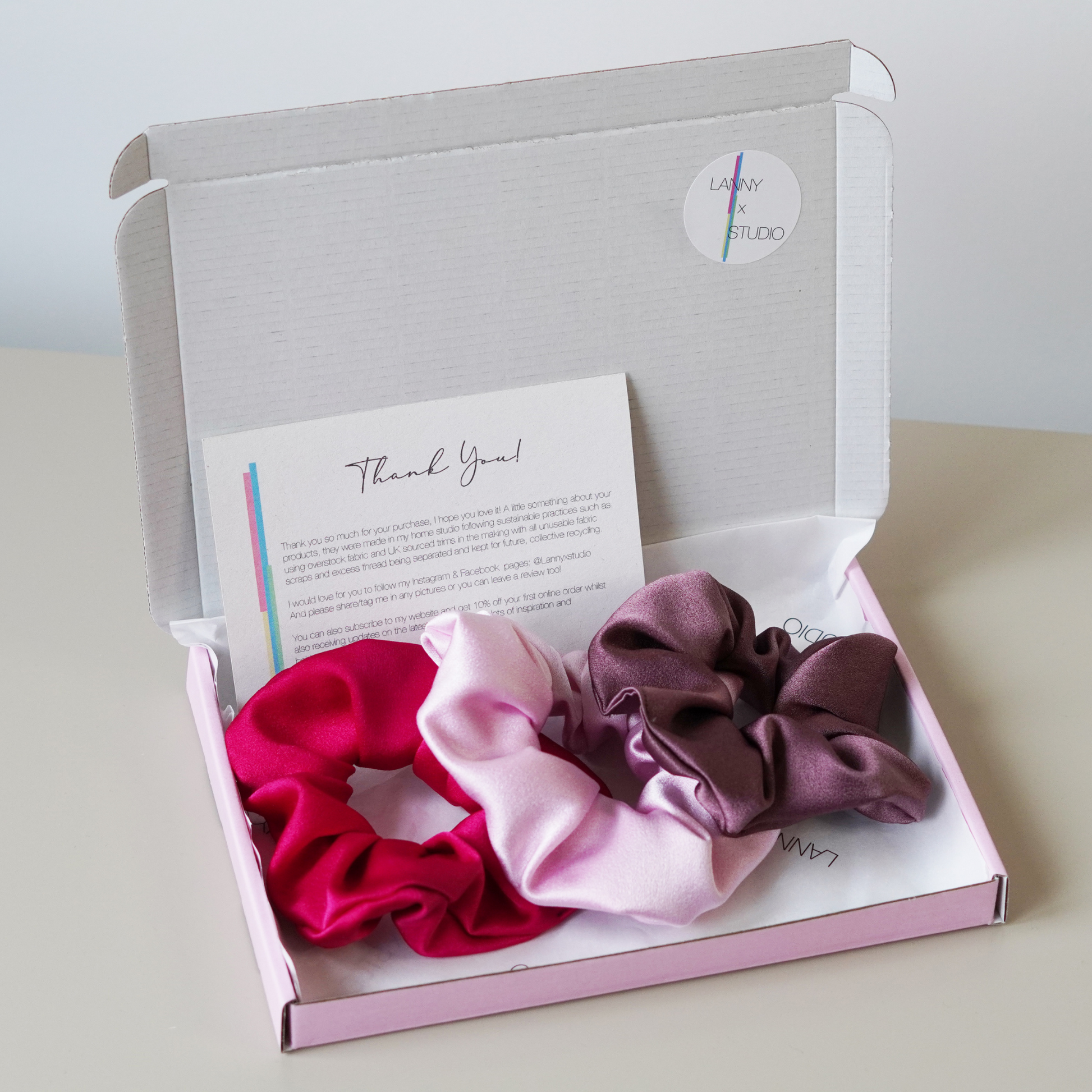 Fuchsia, Pink and Purple Satin collection in pink gift box, branded tissue paper and personalised note. 