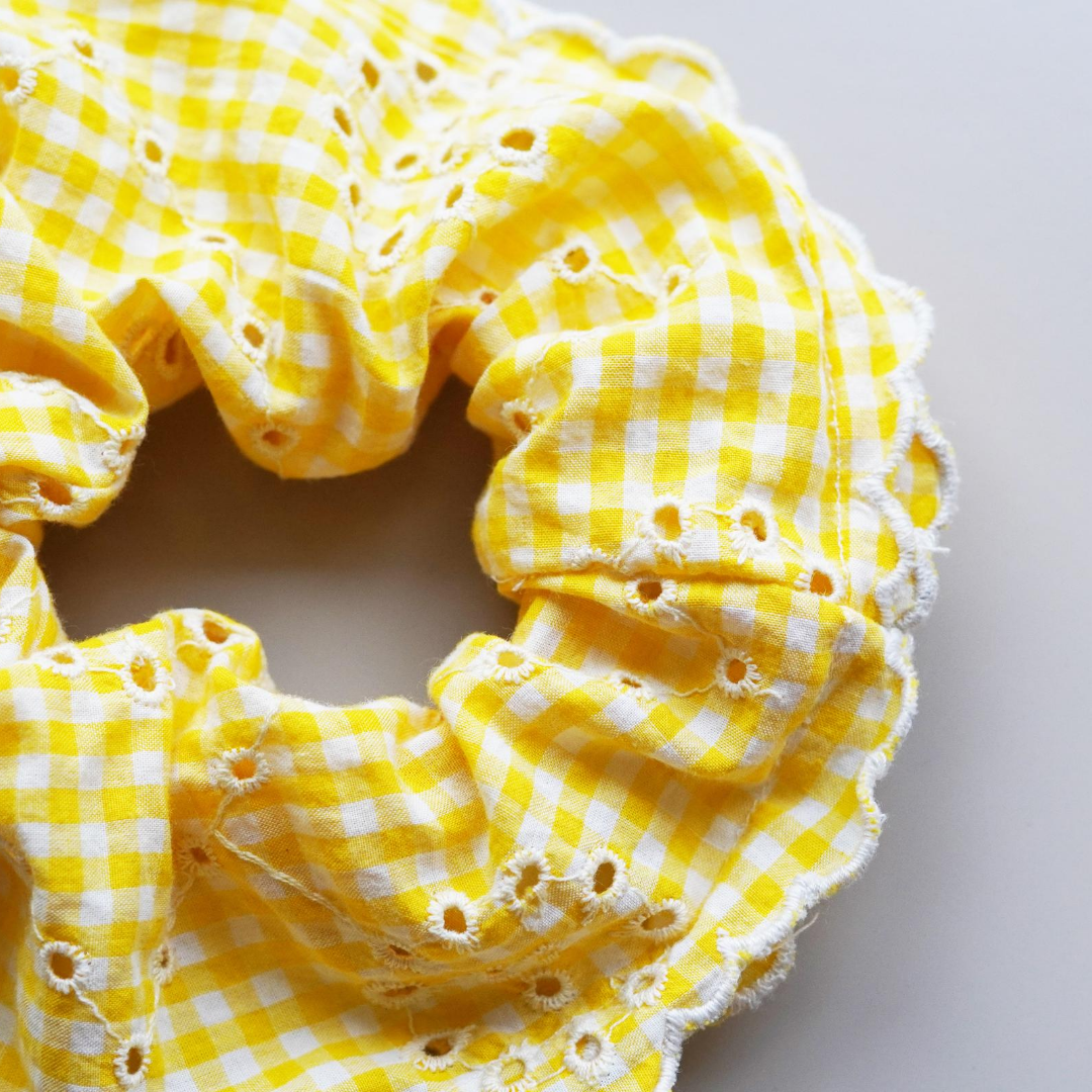 Yellow and white gingham and broiderie anglaise extra large scrunchie with scalloped edge. 
