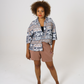 Relaxed fit aztec inspired printed women shirt, worn half closed and half tucked into our cinnamon Jersey shorts. 