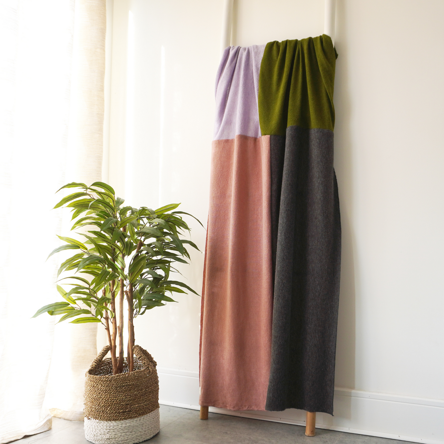 Pink, Green, Lilac and charcoal panelled throw in knit fabric. 