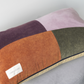 Orange, Purple, Green and Lilac panelled rentable cushion with branded LannyxStudio label. View from above cushion. 