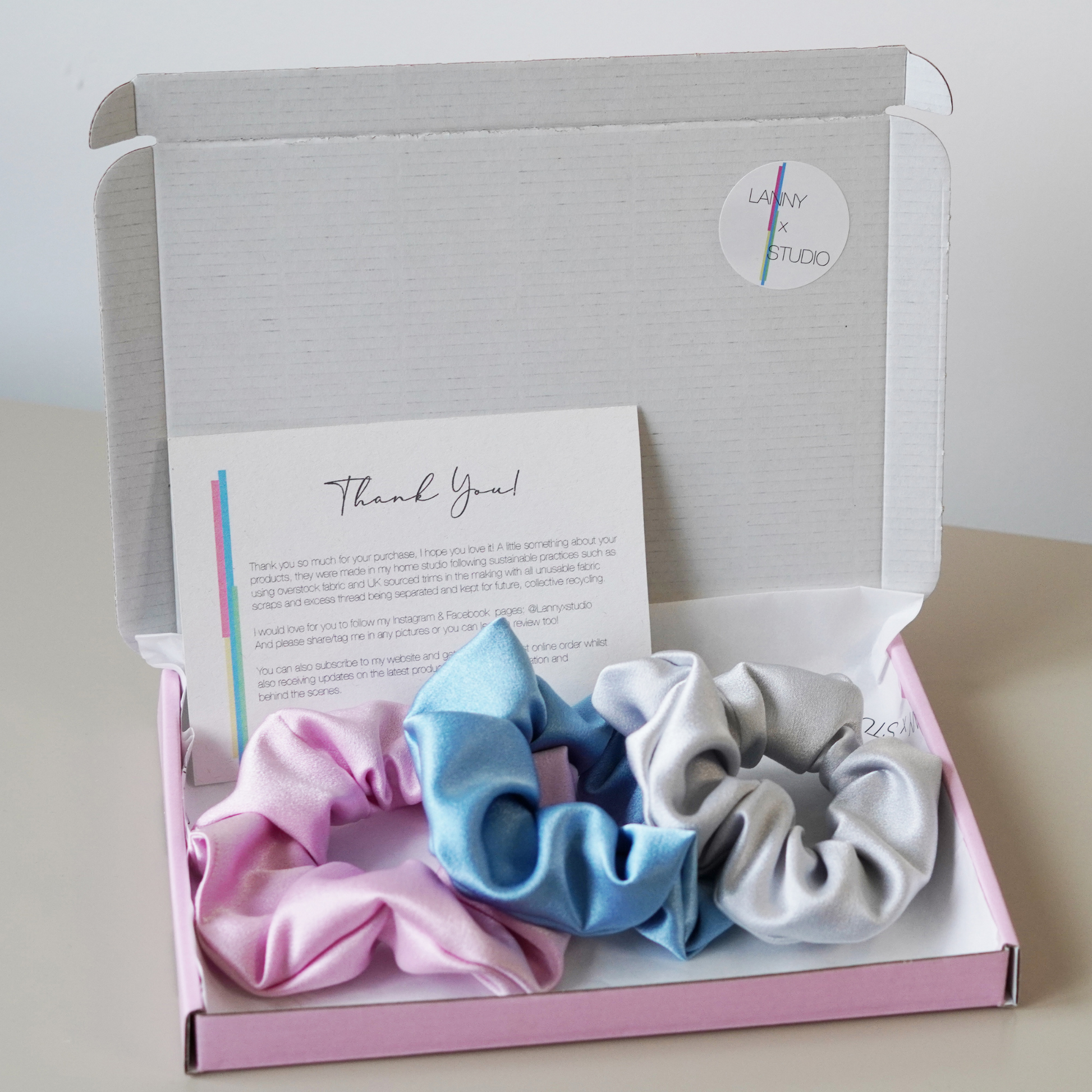Pink, Blue and Silver satin scrunchies in pink gift box, branded tissue paper and personalised note.